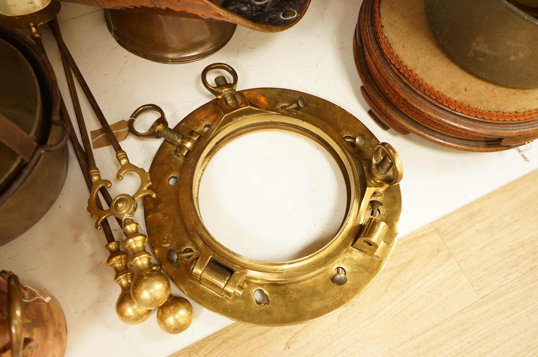 Assorted Victorian and later copper and brassware including two ships portholes, copper kettle pots, etc (16). Large porthole 36cm diameter